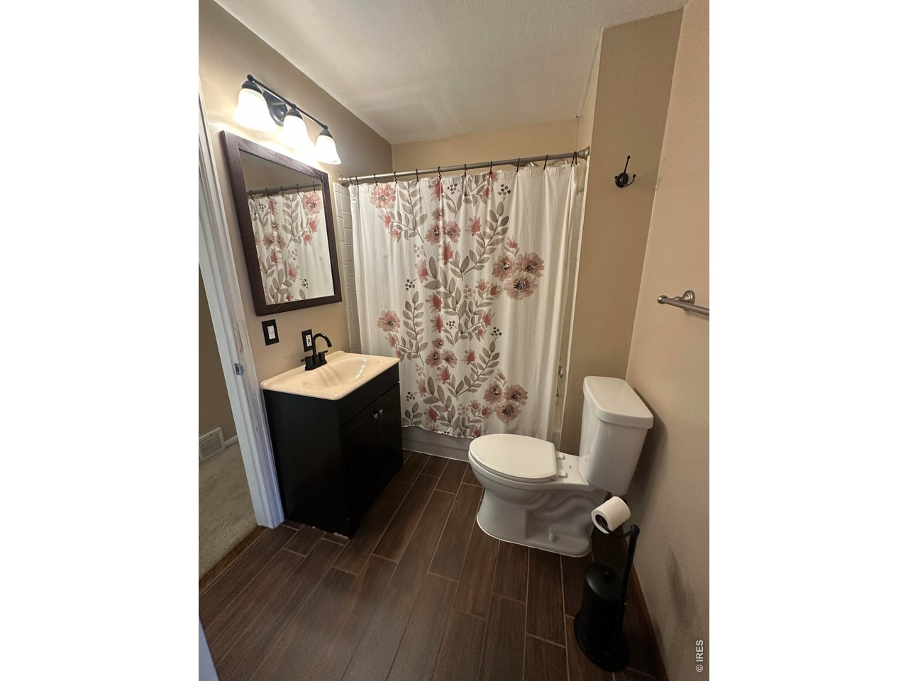 268 Fifth Street Firestone, CO 80520 - Photo 11 of 25 a bathroom with a toilet a sink and mirror
