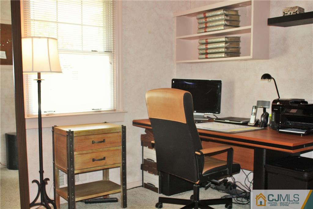 27 Ashley Road Edison, NJ 08817 - Photo 11 of 21 a view of a workspace with furniture and a window