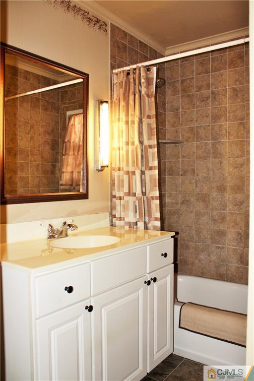 27 Ashley Road Edison, NJ 08817 - Photo 12 of 21 a bathroom with a sink and a mirror