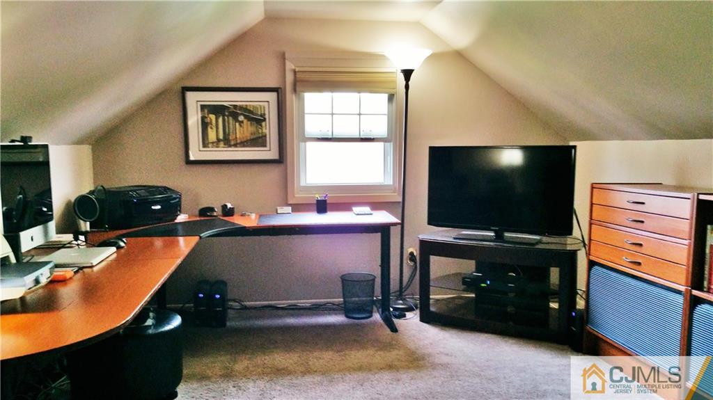 27 Ashley Road Edison, NJ 08817 - Photo 13 of 21 a room with furniture and flat screen tv