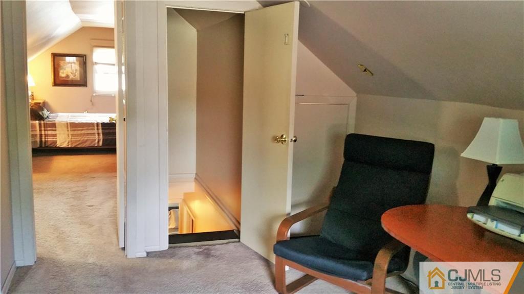 27 Ashley Road Edison, NJ 08817 - Photo 14 of 21 a living room with furniture and a floor to ceiling window