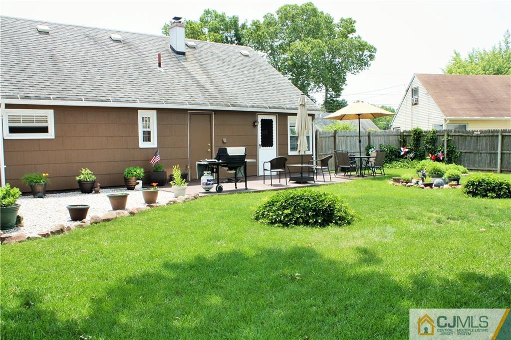 27 Ashley Road Edison, NJ 08817 - Photo 18 of 21 a view of a house with a yard porch and sitting area