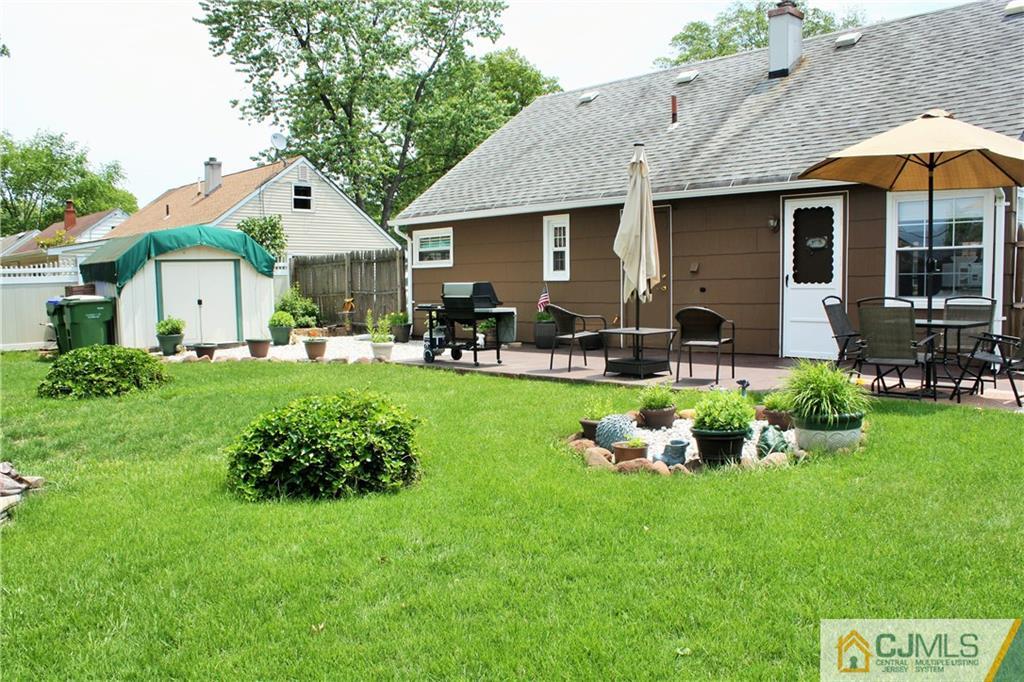 27 Ashley Road Edison, NJ 08817 - Photo 19 of 21 a front view of a house with garden