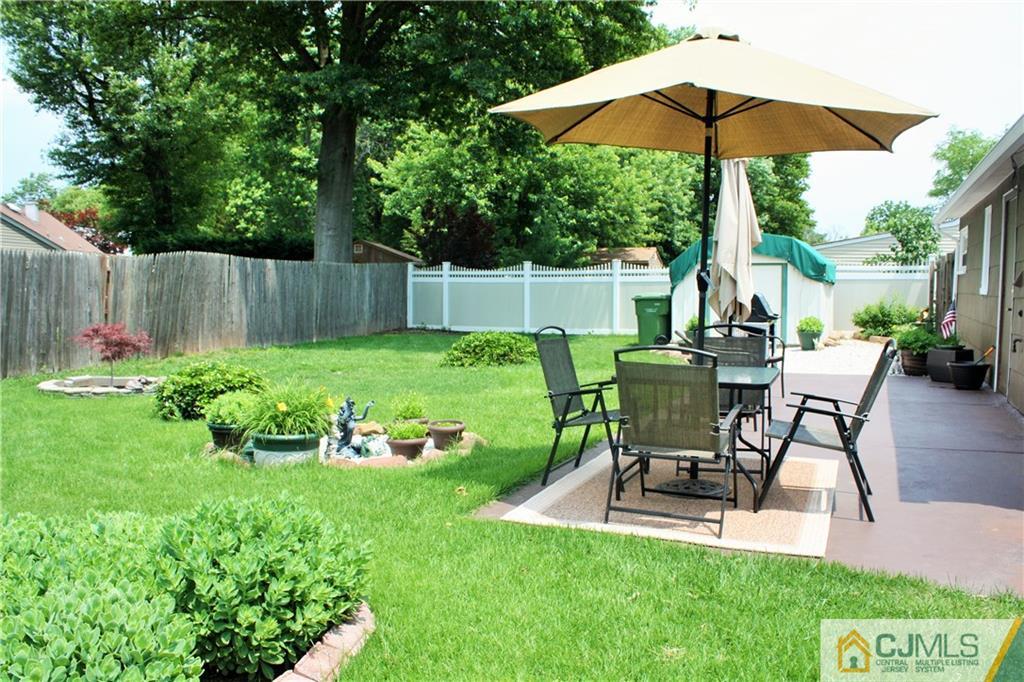 27 Ashley Road Edison, NJ 08817 - Photo 21 of 21 a view of backyard with seating space and garden