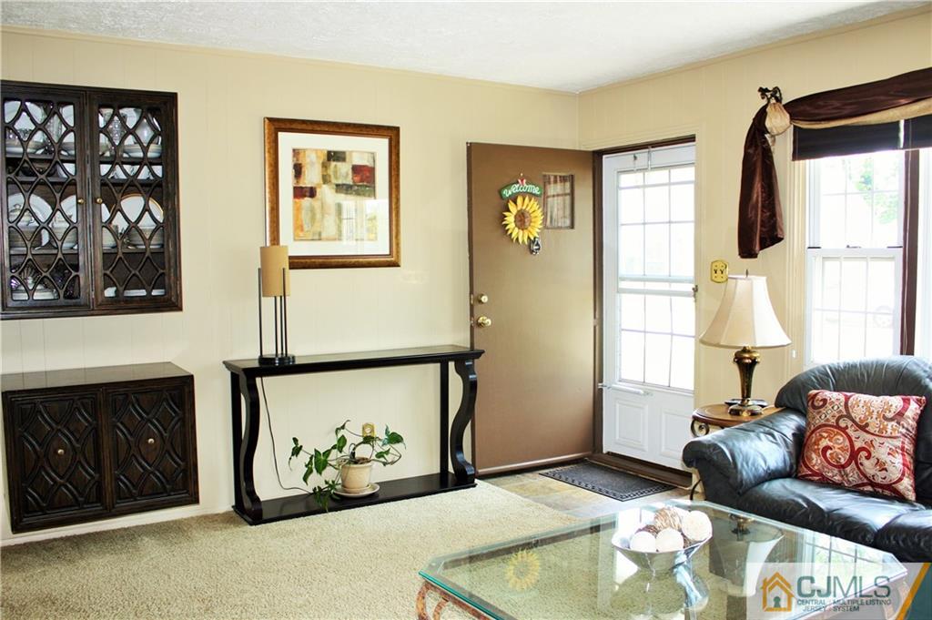 27 Ashley Road Edison, NJ 08817 - Photo 4 of 21 a living room with furniture and a window