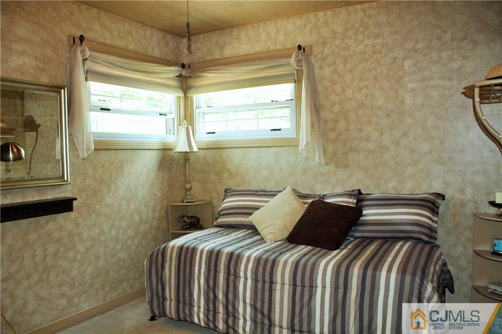 27 Ashley Road Edison, NJ 08817 - Photo 10 of 21 a bedroom with a bed and a window
