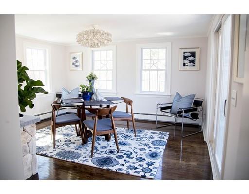 696 Queen Anne Road Harwich, MA 02645 - Photo 13 of 18 a living room with furniture a dining table and a window