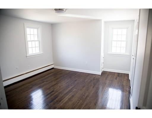 696 Queen Anne Road Harwich, MA 02645 - Photo 15 of 18 a view of an empty room with wooden floor and a window