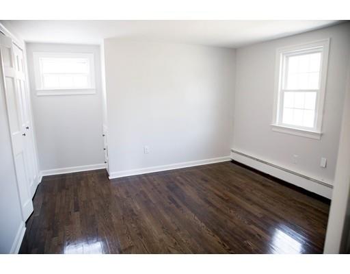 696 Queen Anne Road Harwich, MA 02645 - Photo 16 of 18 a view of an empty room with wooden floor and a window