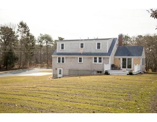 696 Queen Anne Road Harwich, MA 02645 - Photo 18 of 18 a house view with swimming pool in front of it