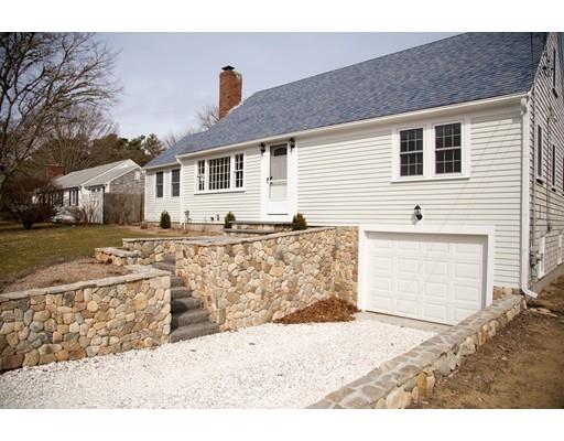 696 Queen Anne Road Harwich, MA 02645 - Photo 2 of 18 a front view of a house with a yard