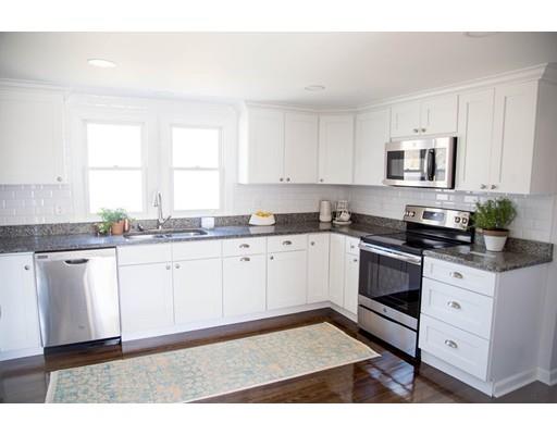696 Queen Anne Road Harwich, MA 02645 - Photo 8 of 18 a kitchen with granite countertop white cabinets and white appliances