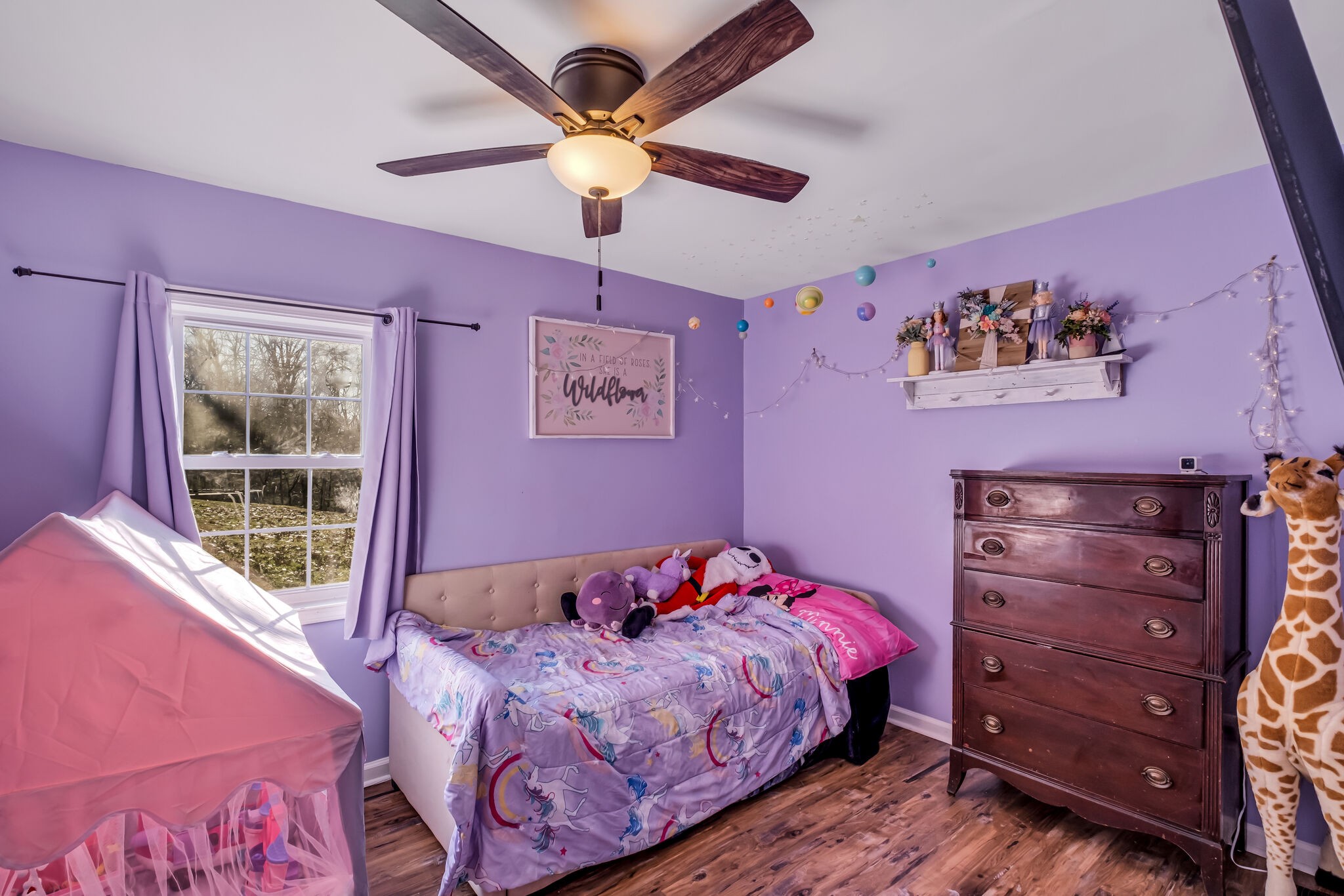 3197 Stephens Road Columbia, TN 38401 - Photo 25 of 46 a bedroom with a bed and a chandelier