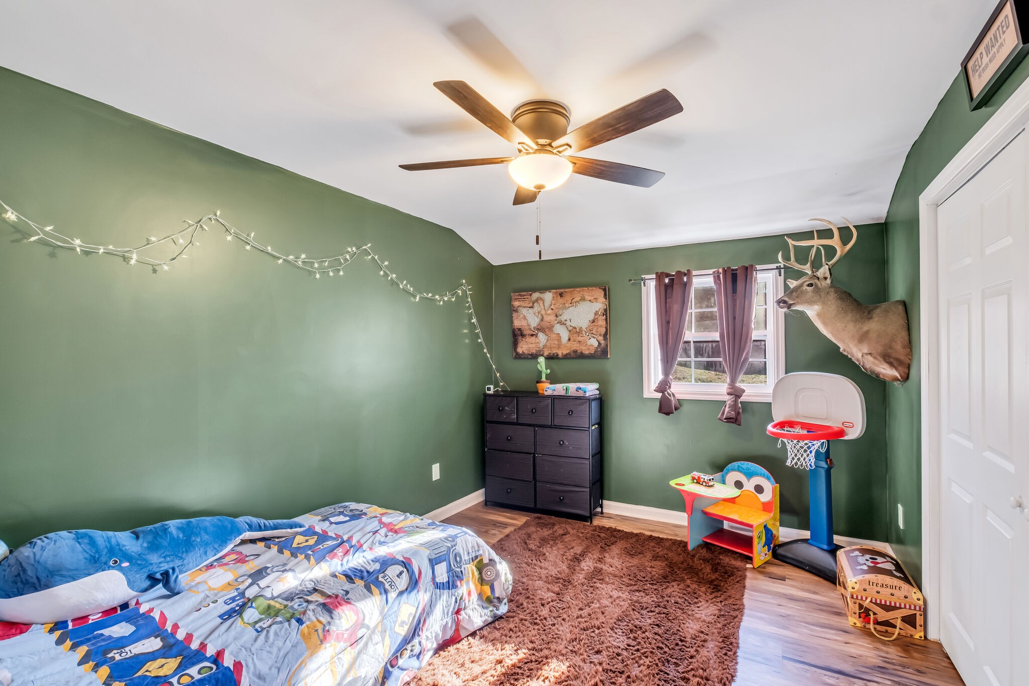 3197 Stephens Road Columbia, TN 38401 - Photo 28 of 46 a bedroom with a bed and a chandelier