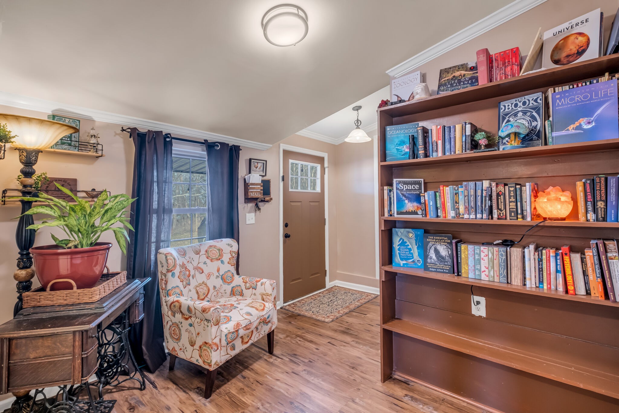 3197 Stephens Road Columbia, TN 38401 - Photo 10 of 46 a living room with furniture and a book shelf