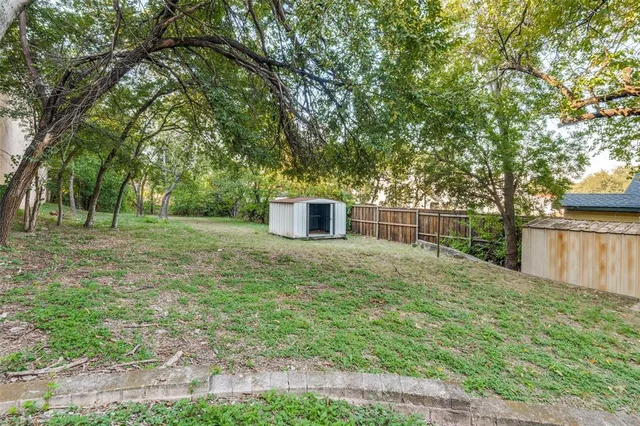 a backyard of a house with lots of green space