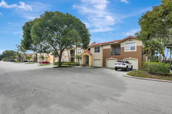 a view of a car parked in front of a house
