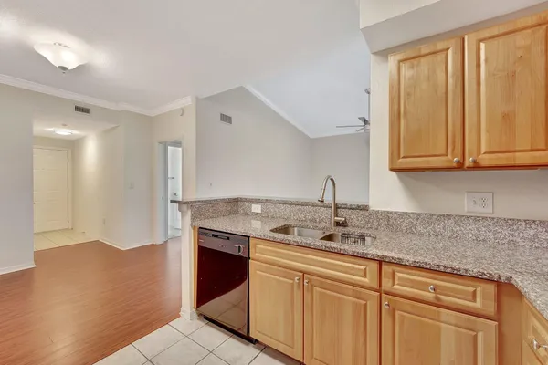 a kitchen with stainless steel appliances granite countertop a sink and a granite counter tops