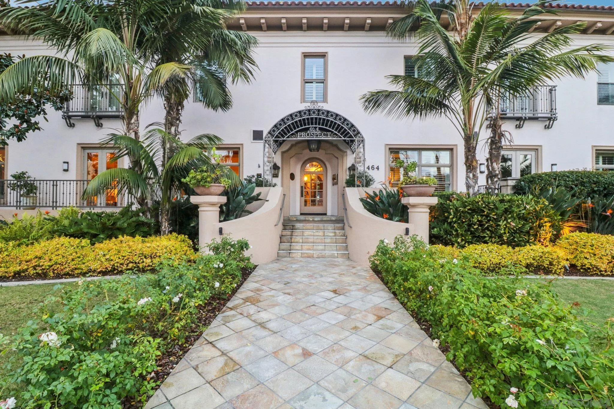 464 Prospect Street, Unit 101 La Jolla, CA 92037 - Photo 1 of 65 a front view of a house with garden