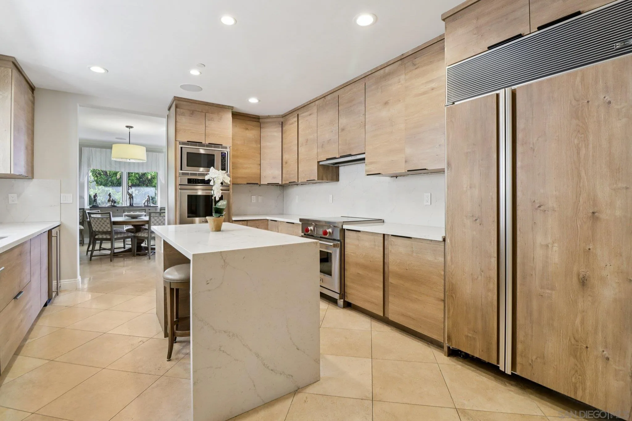 464 Prospect Street, Unit 101 La Jolla, CA 92037 - Photo 16 of 65 a kitchen with a refrigerator a sink and cabinets
