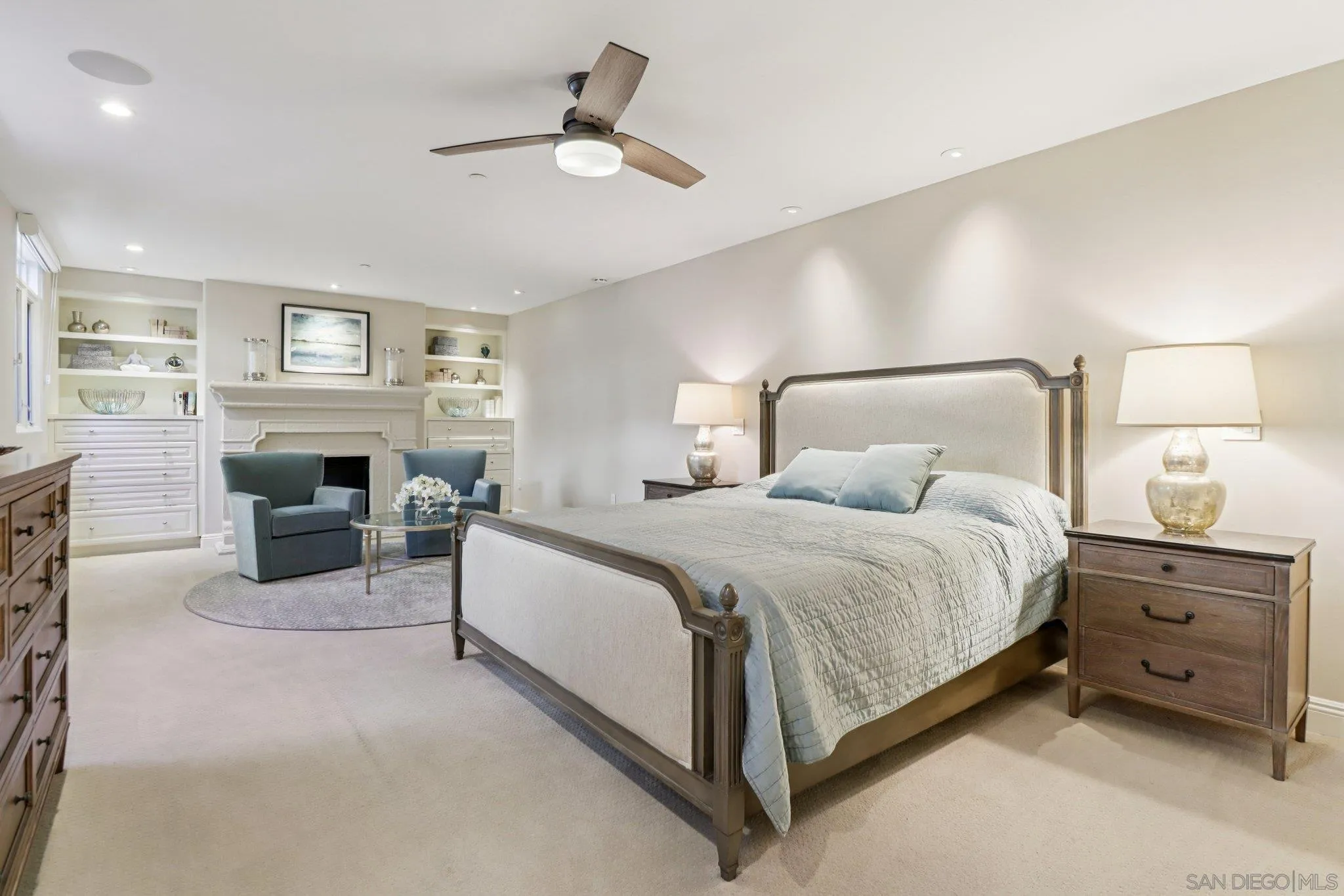 464 Prospect Street, Unit 101 La Jolla, CA 92037 - Photo 20 of 65 a bedroom with a bed and a fireplace