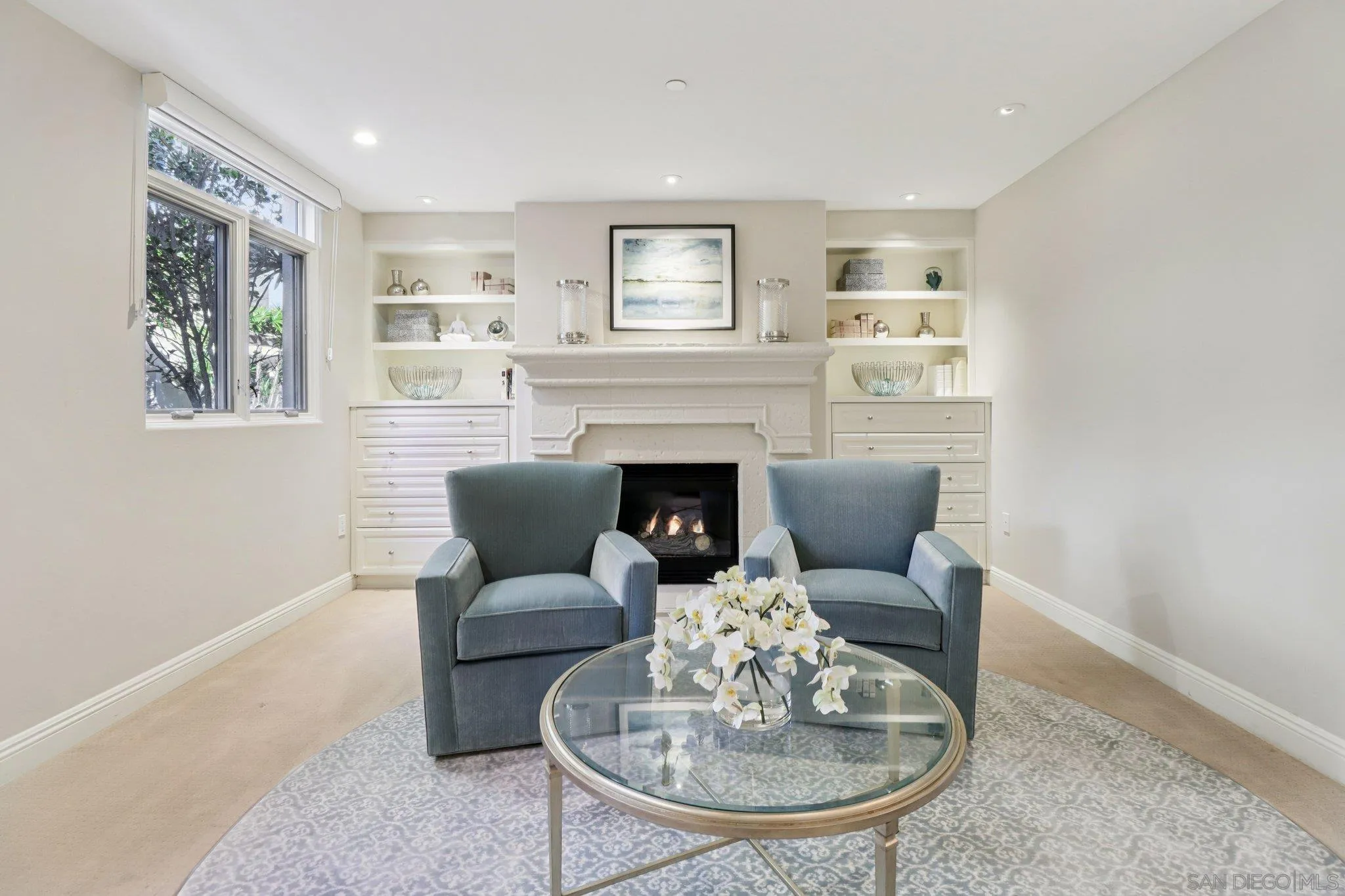 464 Prospect Street, Unit 101 La Jolla, CA 92037 - Photo 22 of 65 a living room with furniture and a fireplace