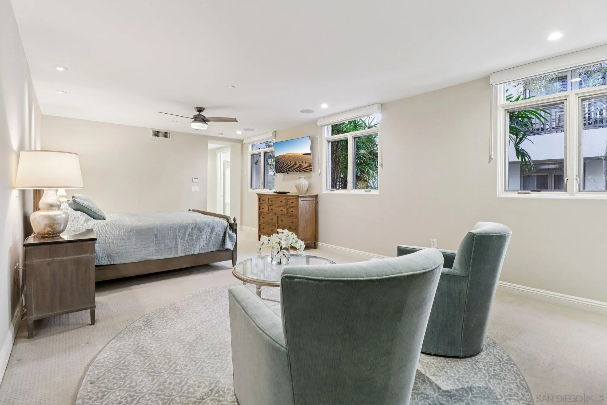 464 Prospect Street, Unit 101 La Jolla, CA 92037 - Photo 23 of 65 a bedroom with a bed and a mirror