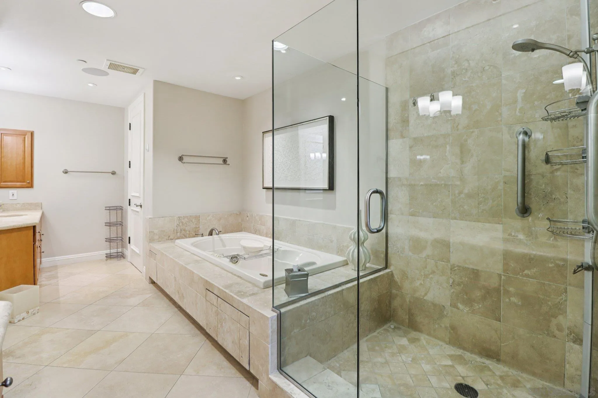 464 Prospect Street, Unit 101 La Jolla, CA 92037 - Photo 25 of 65 a bathroom with a tub shower sink and mirror
