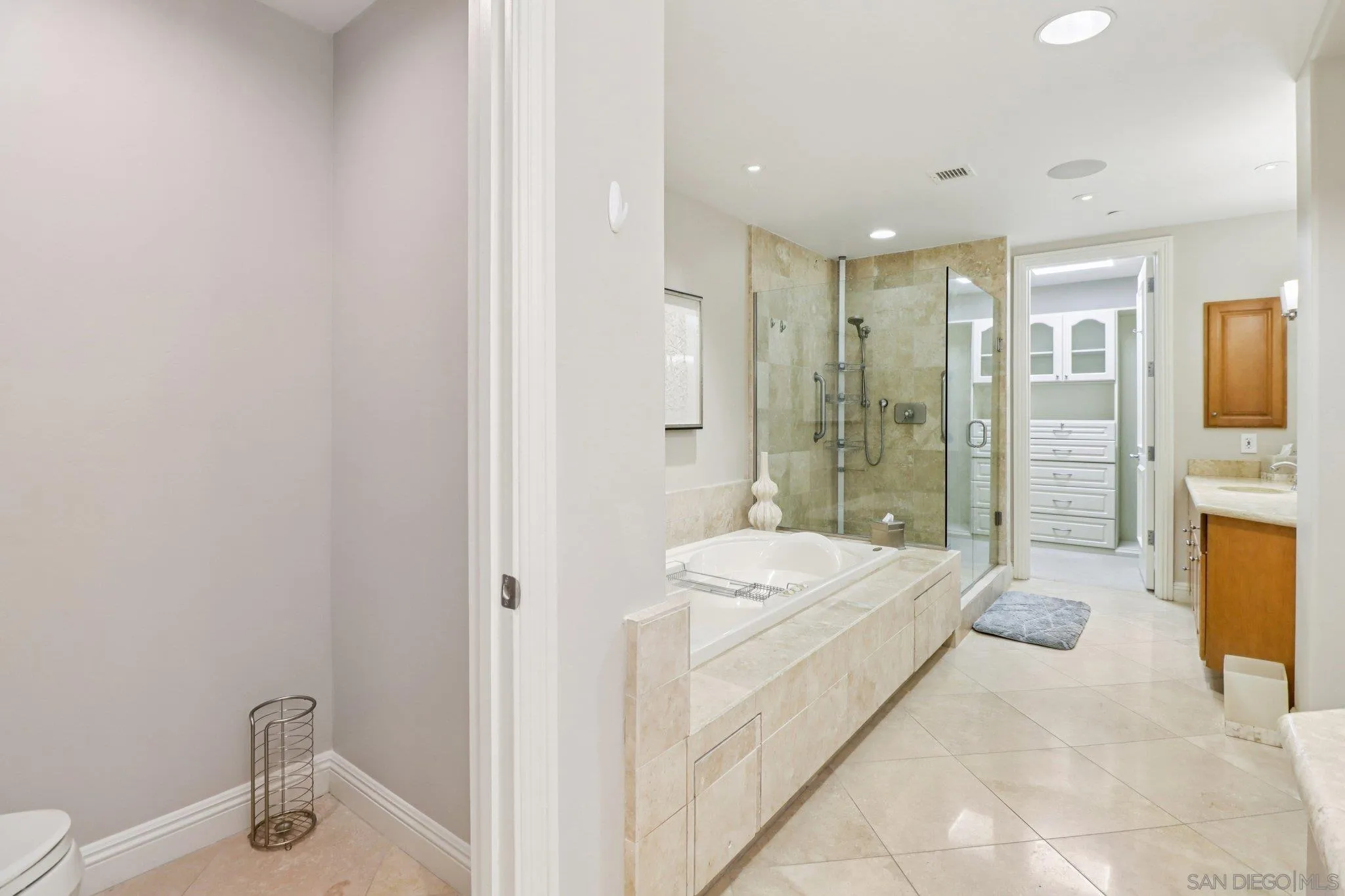 464 Prospect Street, Unit 101 La Jolla, CA 92037 - Photo 26 of 65 a spacious bathroom with a bathtub sink and toilet