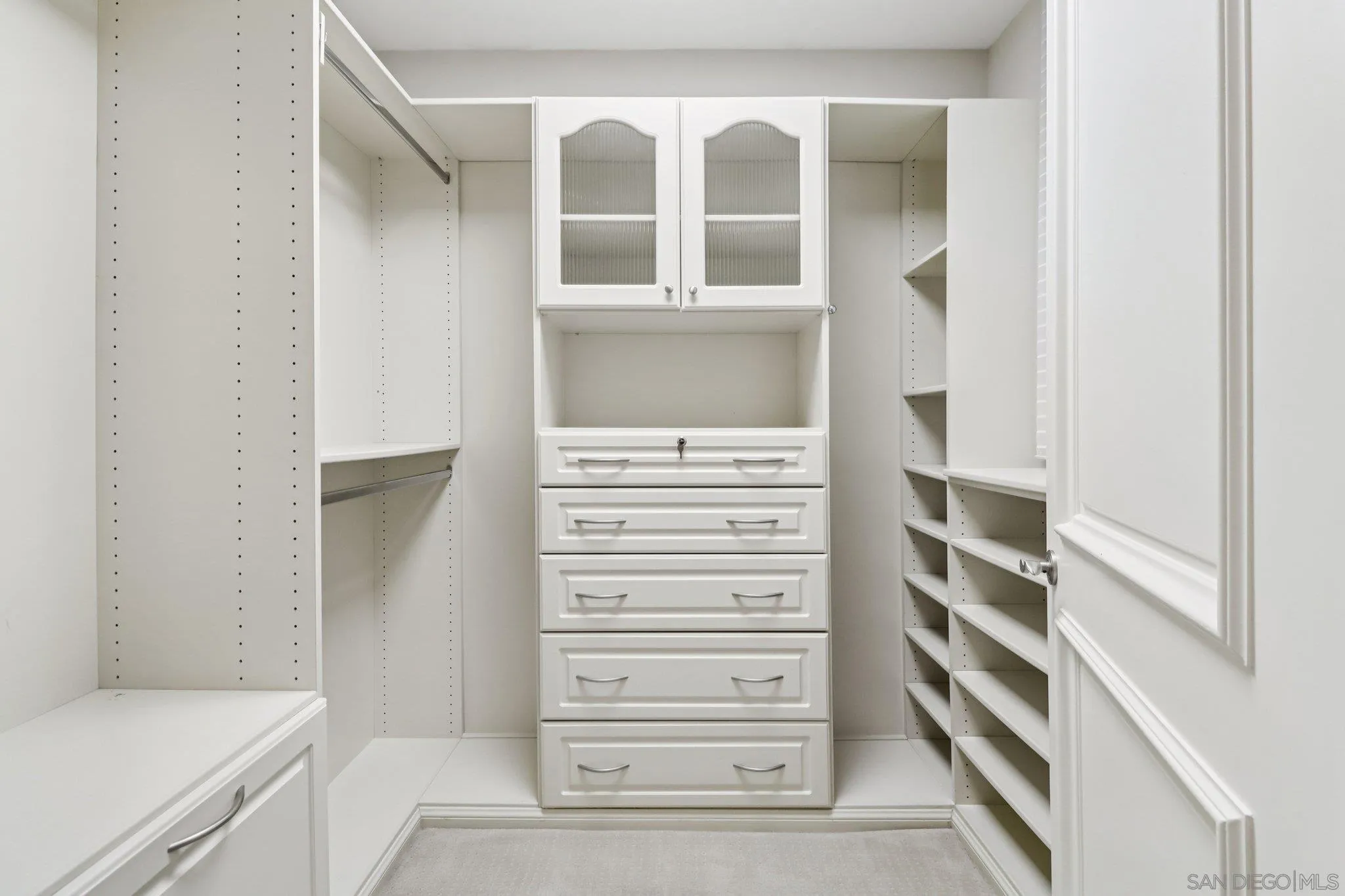 464 Prospect Street, Unit 101 La Jolla, CA 92037 - Photo 29 of 65 a view of walk in closet with empty racks