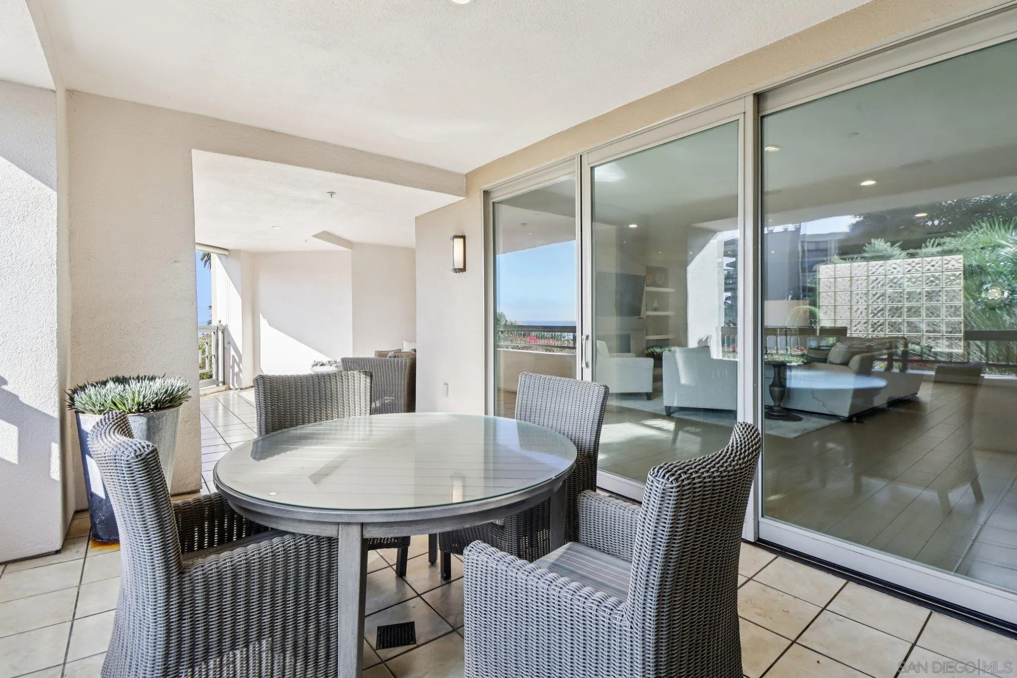464 Prospect Street, Unit 101 La Jolla, CA 92037 - Photo 37 of 65 a view of a dining room with furniture and wooden floor
