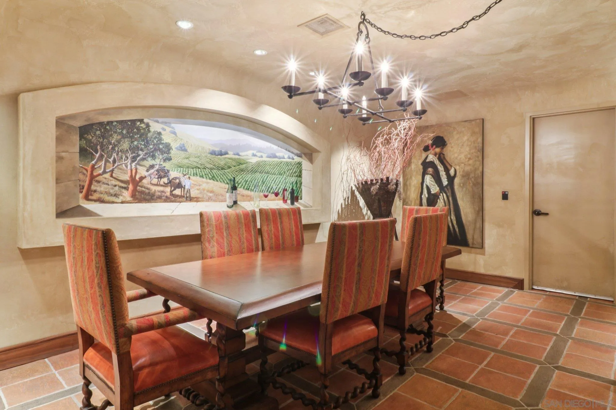 464 Prospect Street, Unit 101 La Jolla, CA 92037 - Photo 40 of 65 a view of a dining room with furniture a chandelier and wooden floor
