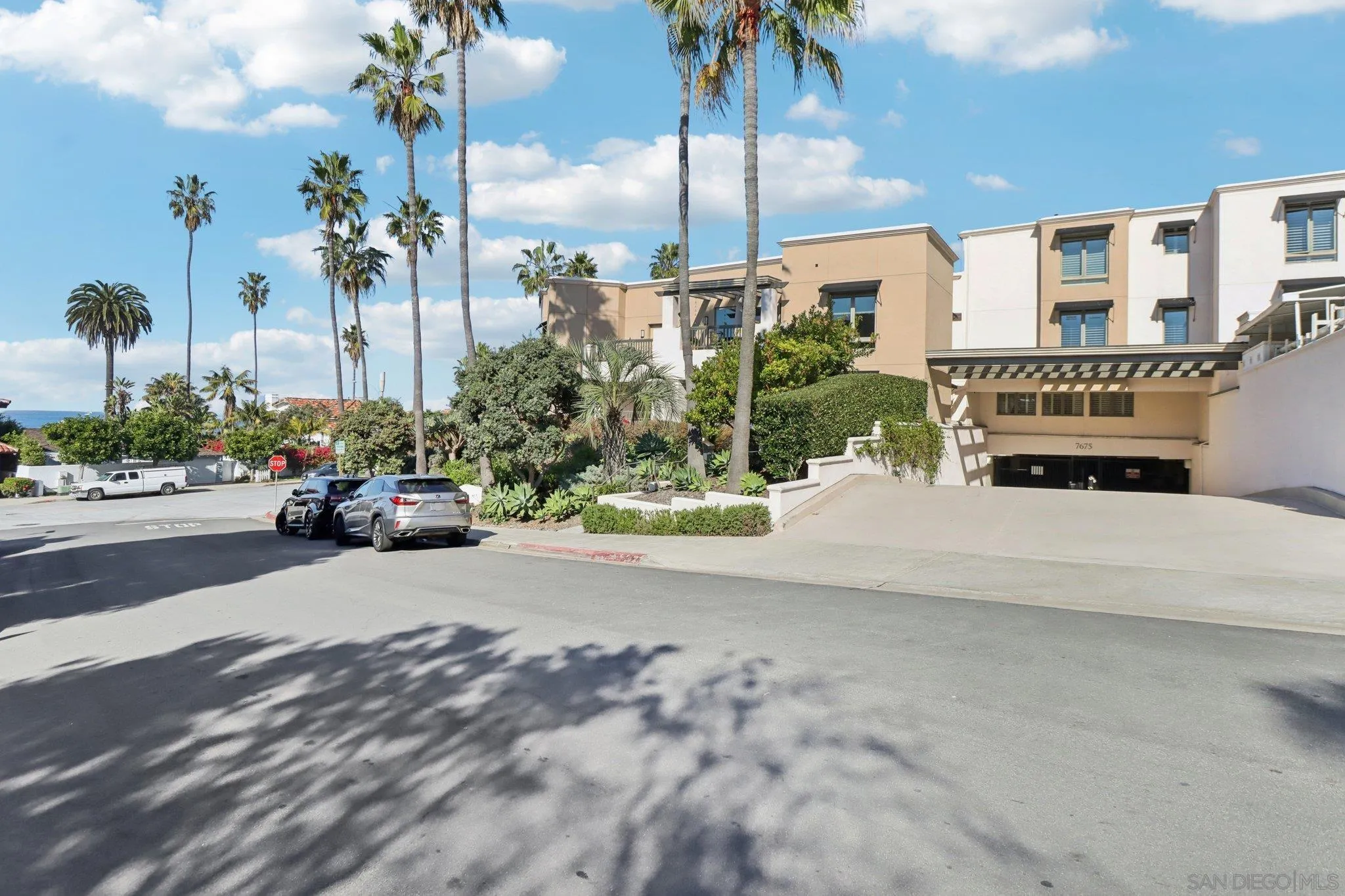 464 Prospect Street, Unit 101 La Jolla, CA 92037 - Photo 63 of 65 a cars parked in front of a building