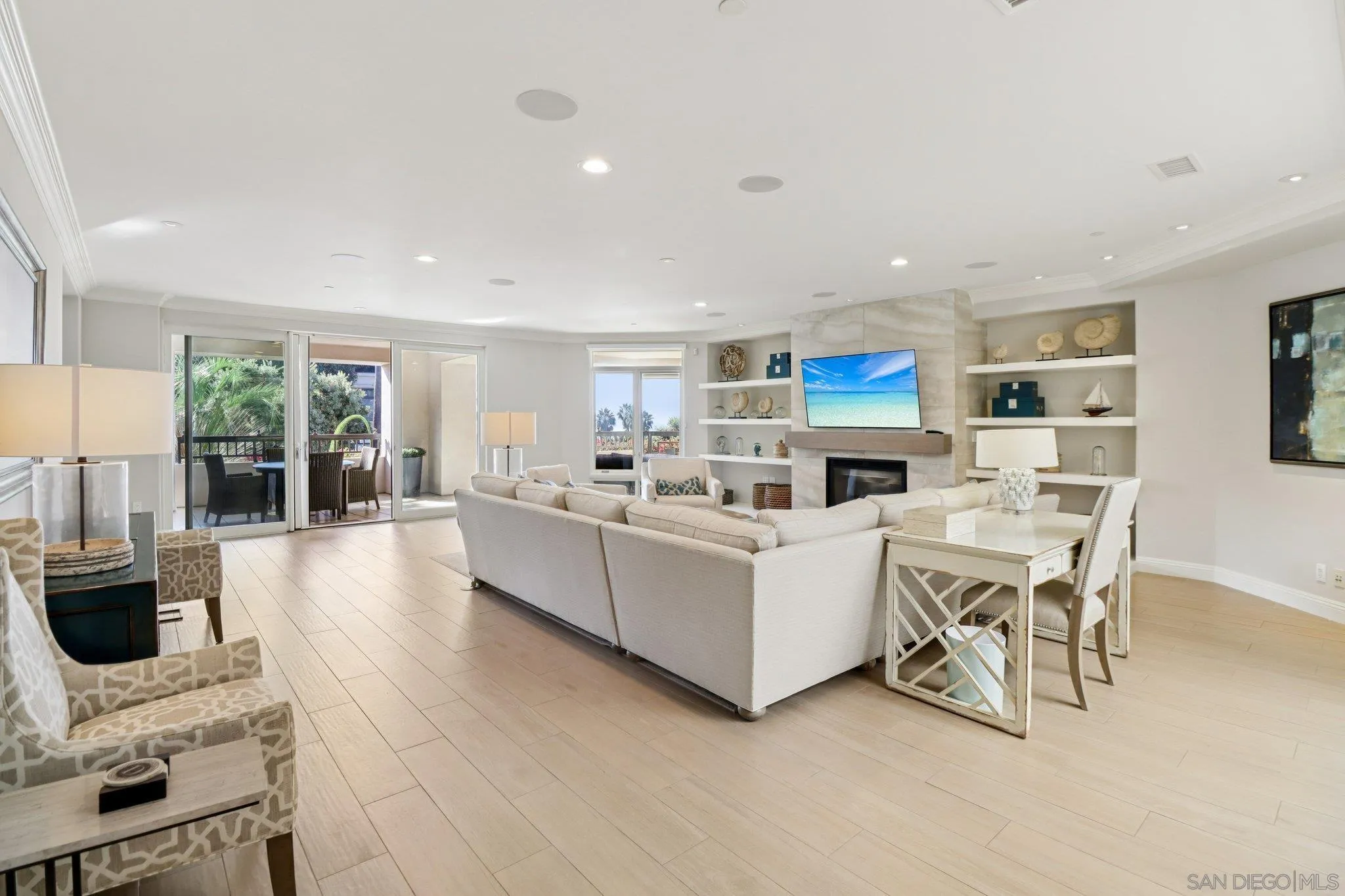 464 Prospect Street, Unit 101 La Jolla, CA 92037 - Photo 8 of 65 a living room with furniture a fireplace and a flat screen tv