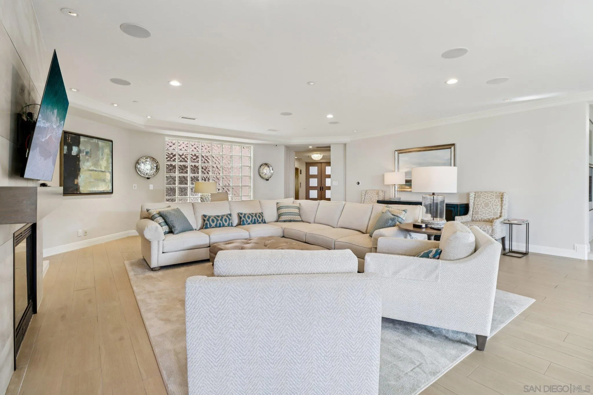 464 Prospect Street, Unit 101 La Jolla, CA 92037 - Photo 9 of 65 a living room with furniture and a flat screen tv