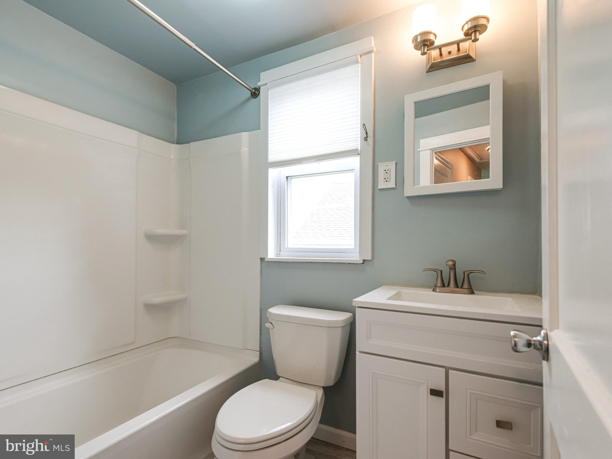 23 Pleasant Road Broomall, PA 19008 - Photo 20 of 36 a bathroom with a sink mirror toilet and bathtub