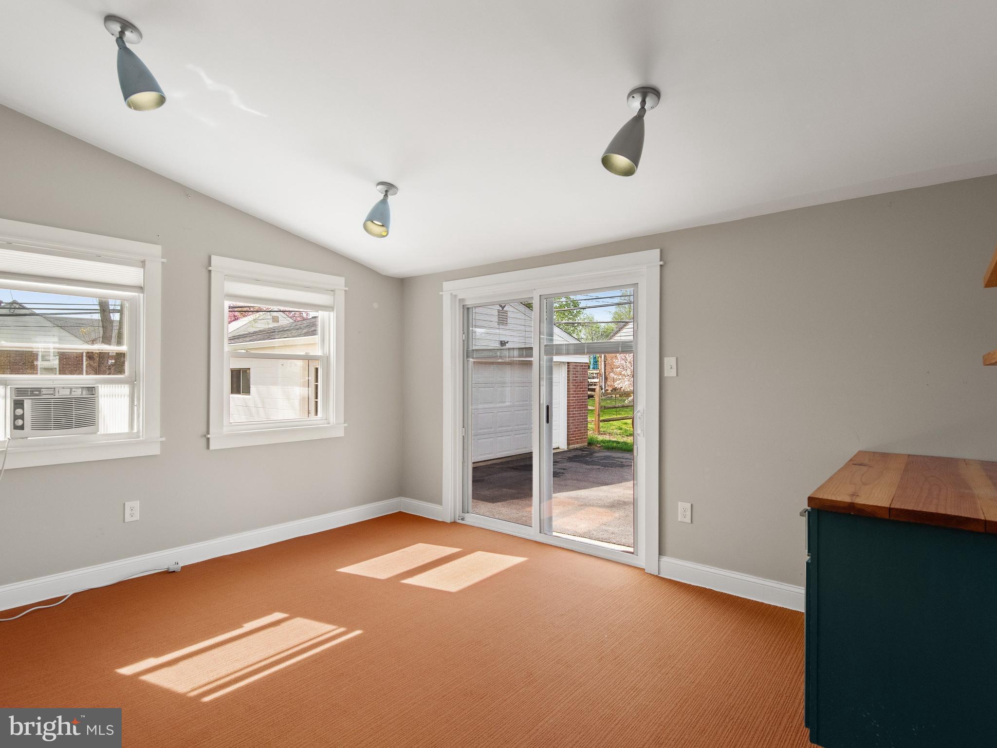 23 Pleasant Road Broomall, PA 19008 - Photo 21 of 36 a view of empty room with wooden floor and fan