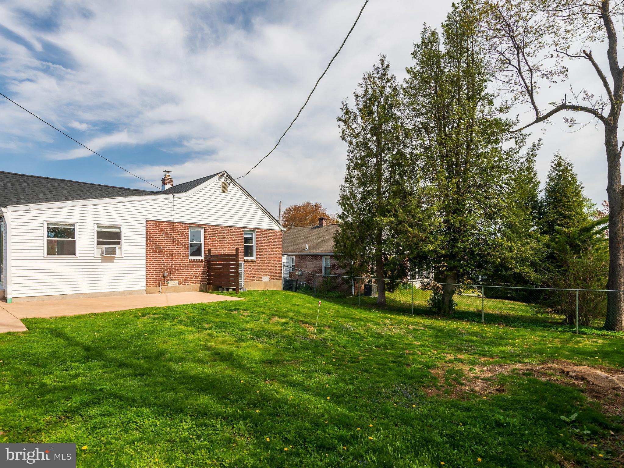 23 Pleasant Road Broomall, PA 19008 - Photo 34 of 36 a front view of house with yard and green space