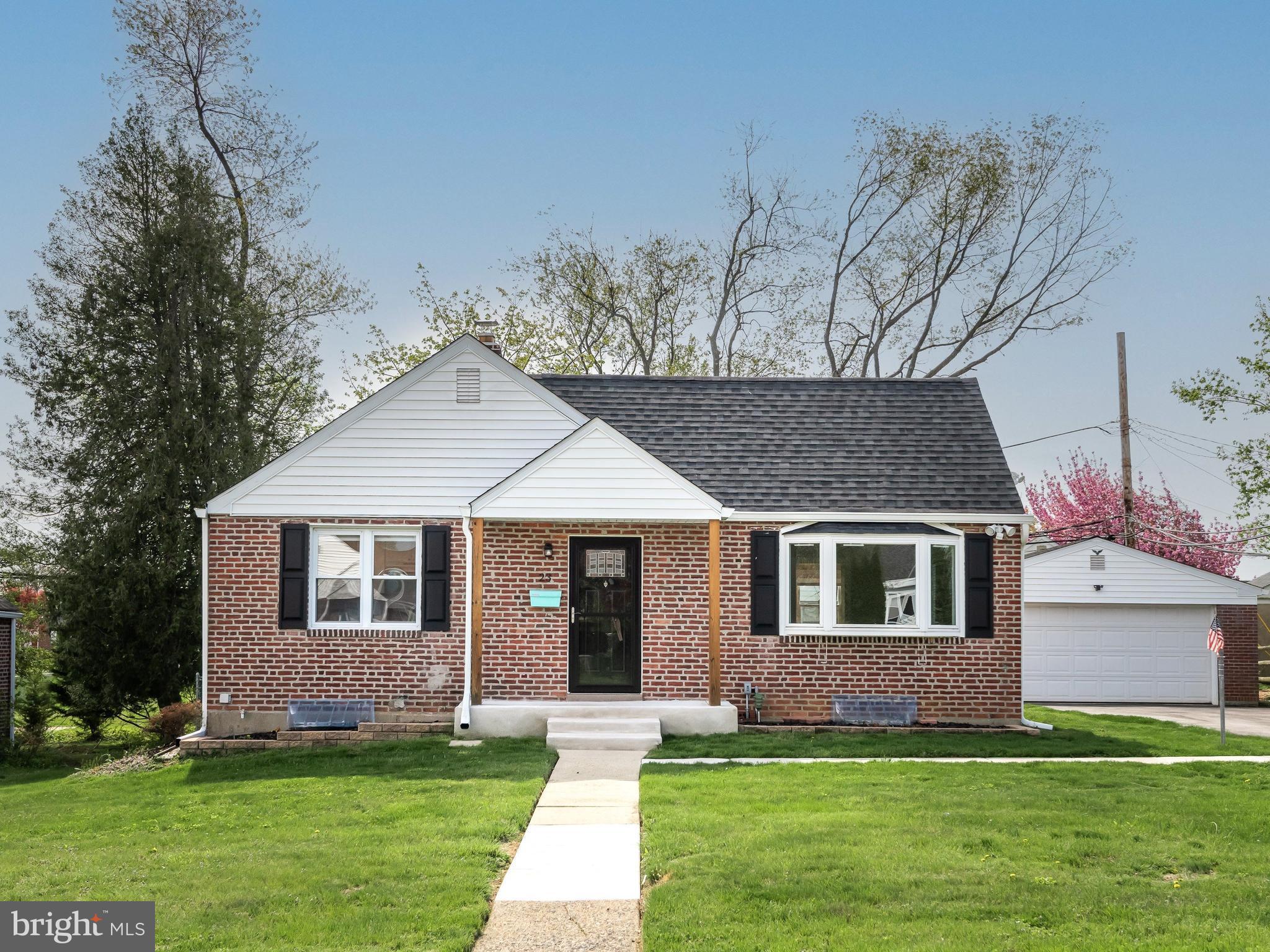 23 Pleasant Road Broomall, PA 19008 - Photo 4 of 36 a front view of a house with a garden and yard