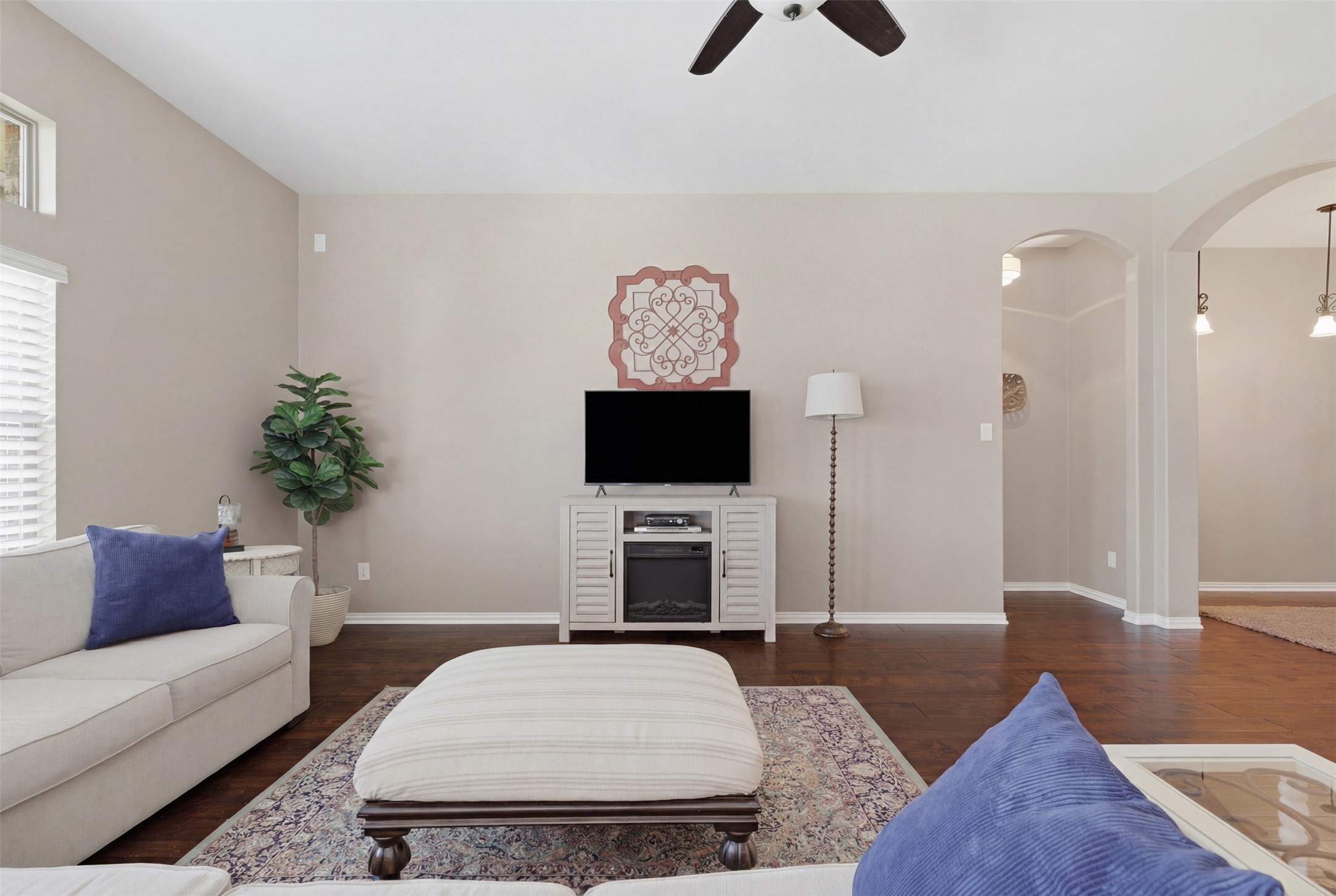 2568 Santa Barbara Loop Round Rock, TX 78665 - Photo 6 of 34 a living room with furniture and a flat screen tv