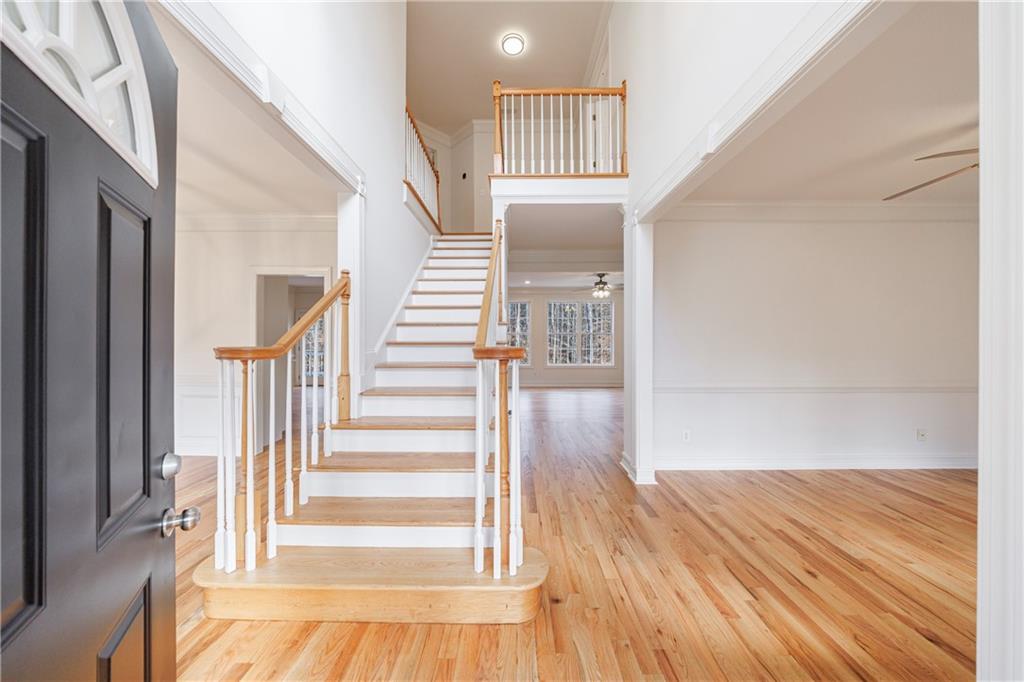 4049 Ashford Way Gainesville, GA 30507 - Photo 14 of 74 a view of entryway with wooden floor and stairs