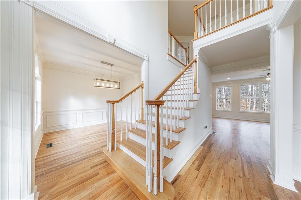 4049 Ashford Way Gainesville, GA 30507 - Photo 15 of 74 a view of entryway and hall with wooden floor