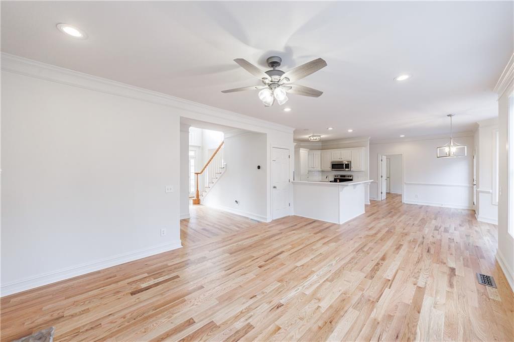 4049 Ashford Way Gainesville, GA 30507 - Photo 26 of 74 a big room with wooden floor and windows