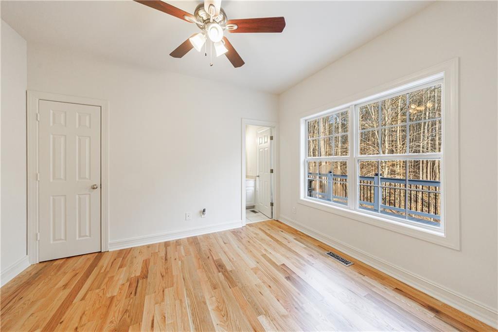 4049 Ashford Way Gainesville, GA 30507 - Photo 36 of 74 a view of empty room with wooden floor and fan