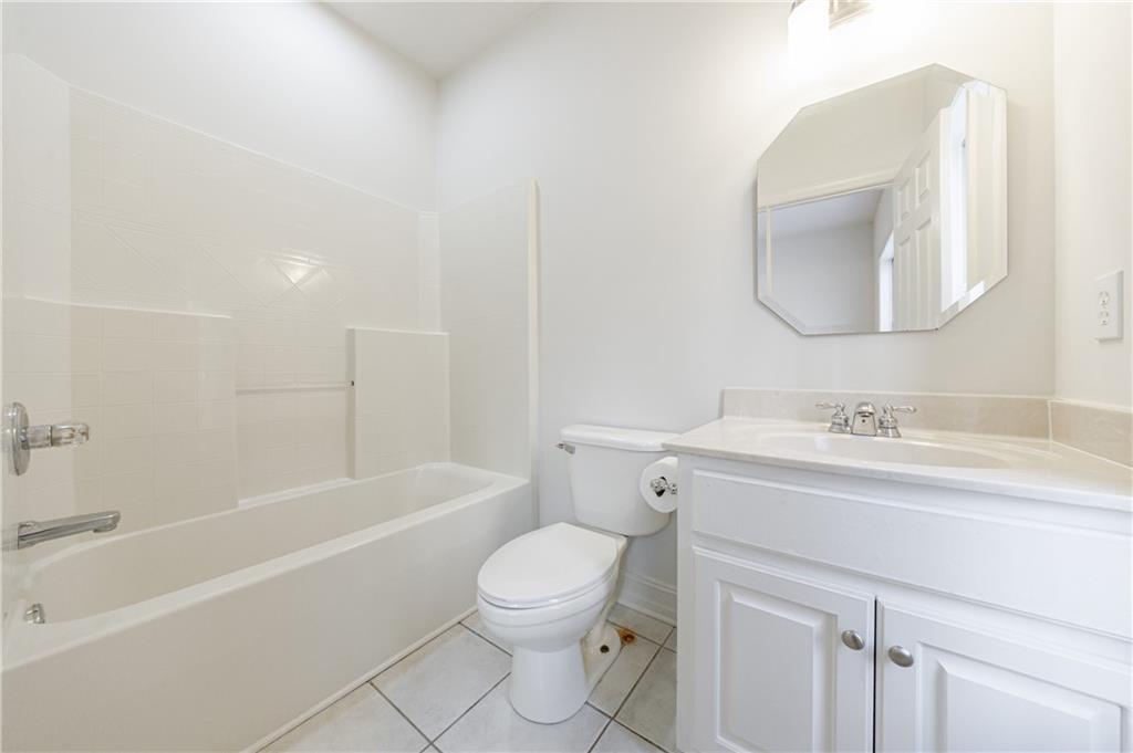 4049 Ashford Way Gainesville, GA 30507 - Photo 38 of 74 a bathroom with a sink toilet vanity and bathtub