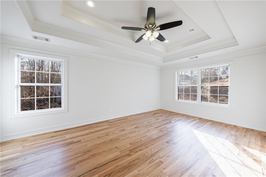 4049 Ashford Way Gainesville, GA 30507 - Photo 42 of 74 a view of an empty room with a window and wooden floor