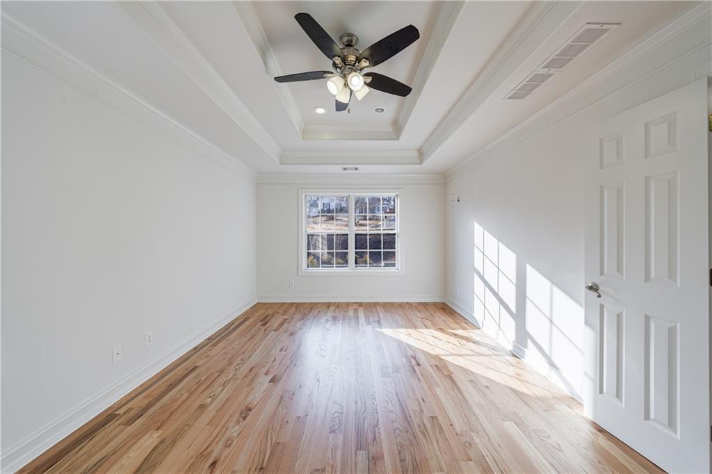 4049 Ashford Way Gainesville, GA 30507 - Photo 43 of 74 a view of an empty room with wooden floor and a window
