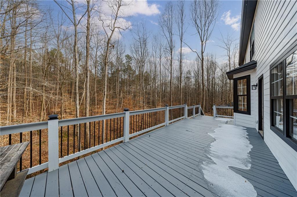 4049 Ashford Way Gainesville, GA 30507 - Photo 6 of 74 a view of a balcony with wooden floor and fence