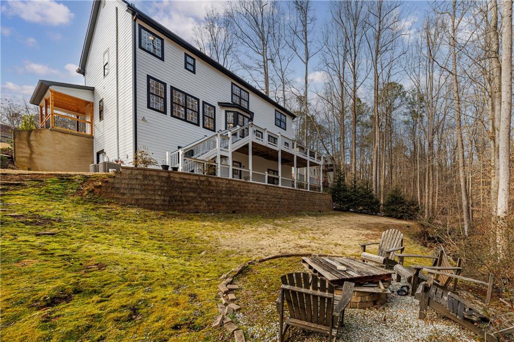 4049 Ashford Way Gainesville, GA 30507 - Photo 9 of 74 a view of a swimming pool with outdoor seating
