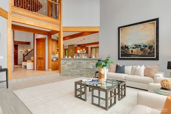 a living room with a table and chairs